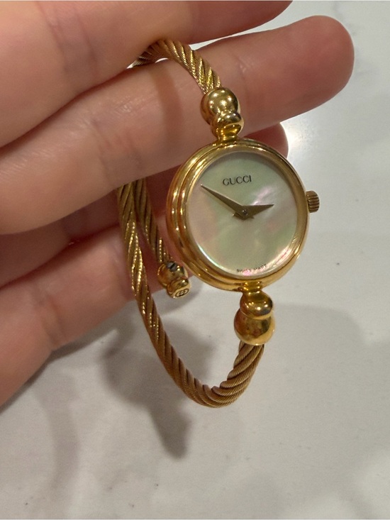 Gucci Accessories - Gucci Gold-Tone Mother-of-Pearl Dial Twisted Bangle Watch